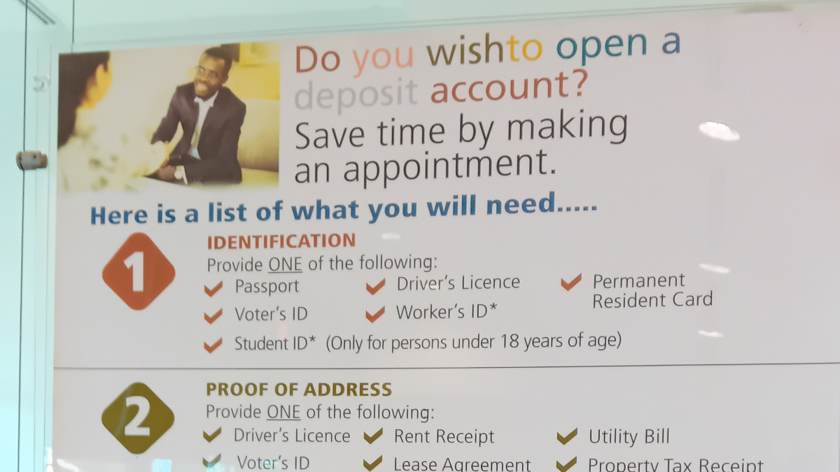 A poster in a bank listing requirements to open a bank account.